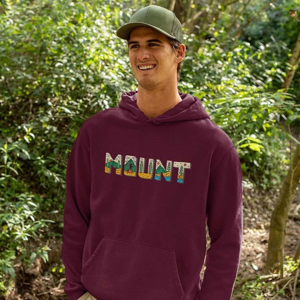 Takeincart maroon hoodie with MOUNT graphic and kangaroo pocket worn by smiling man outdoors summer pattern sando