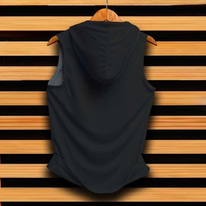 Black sleeveless cotton hooded sandos displayed on hanger against wooden slat wall plain hoodie for casual layering